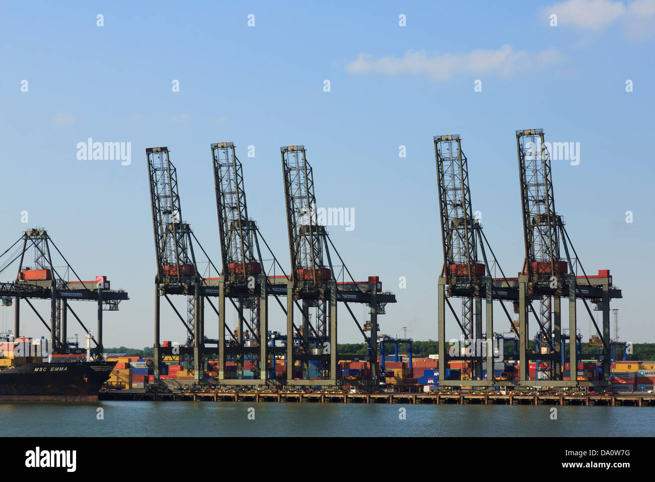Port of Felixstowe gantry cranes for lifting containers on dockside at Trinity terminal quay of largest container port in UK Stock Photo
