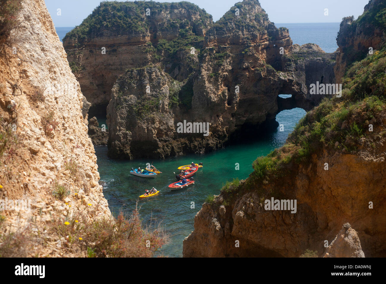 Boat trip in cove surrounded by typical unusual Algarve rock formations Ponta da Piedade Lagos Algarve Portugal Stock Photo