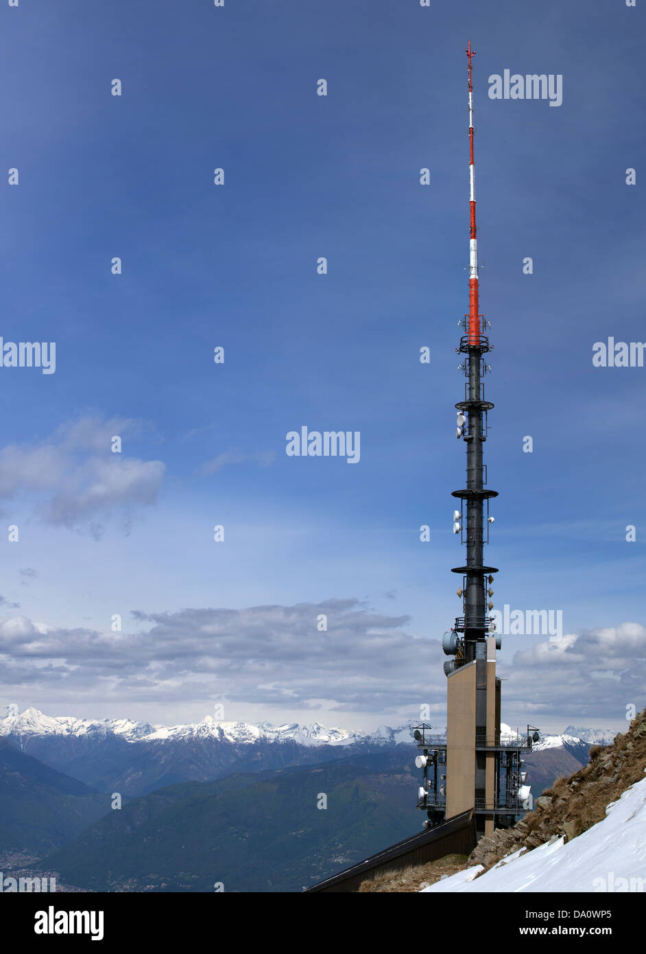 Mountain Ariel mast with various dishes on a mountaintop Stock Photo