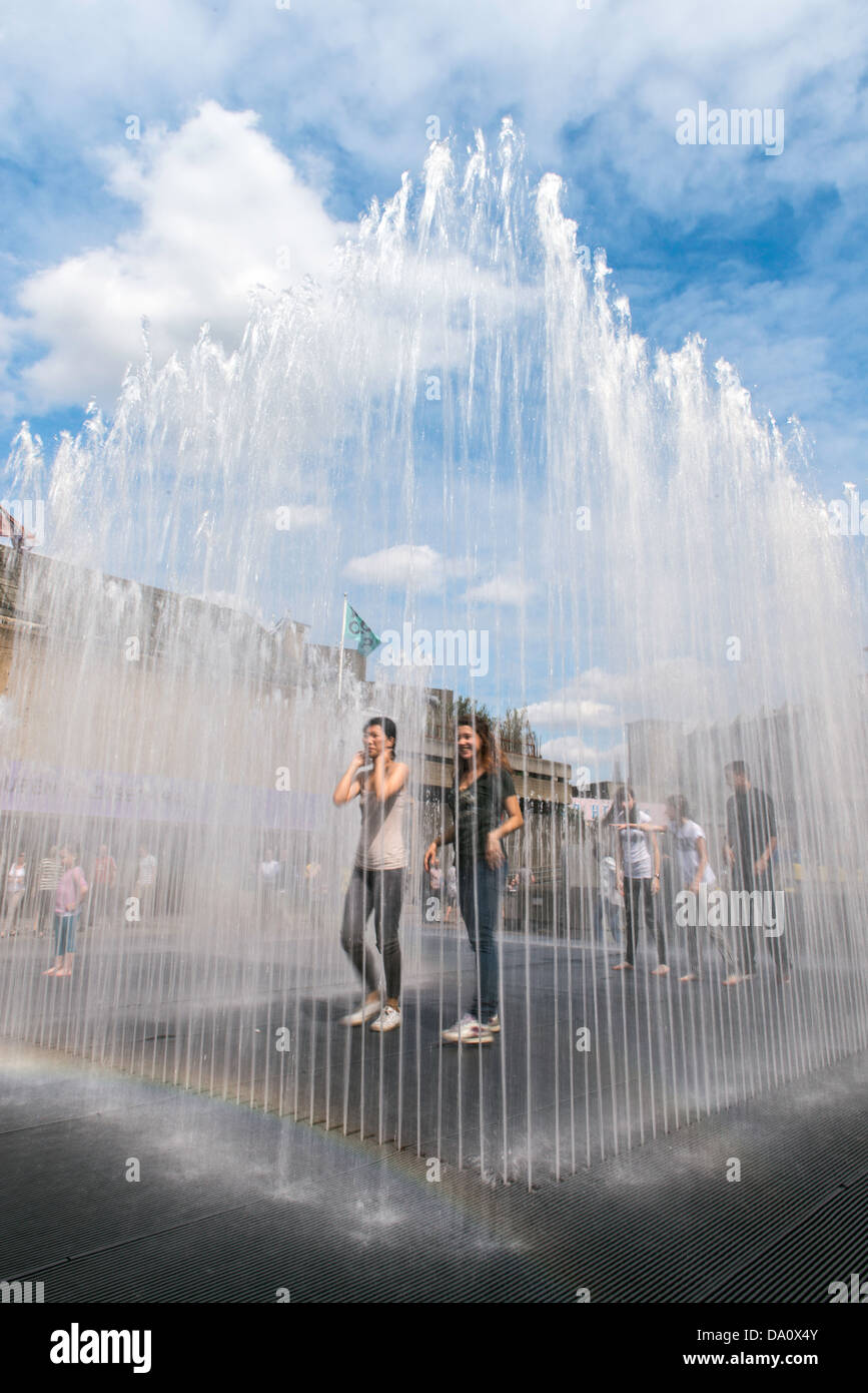 Londoners play at a fountain outside the Queen Elizabeth Hall in the South Bank London England Great Britain UK Europe Stock Photo