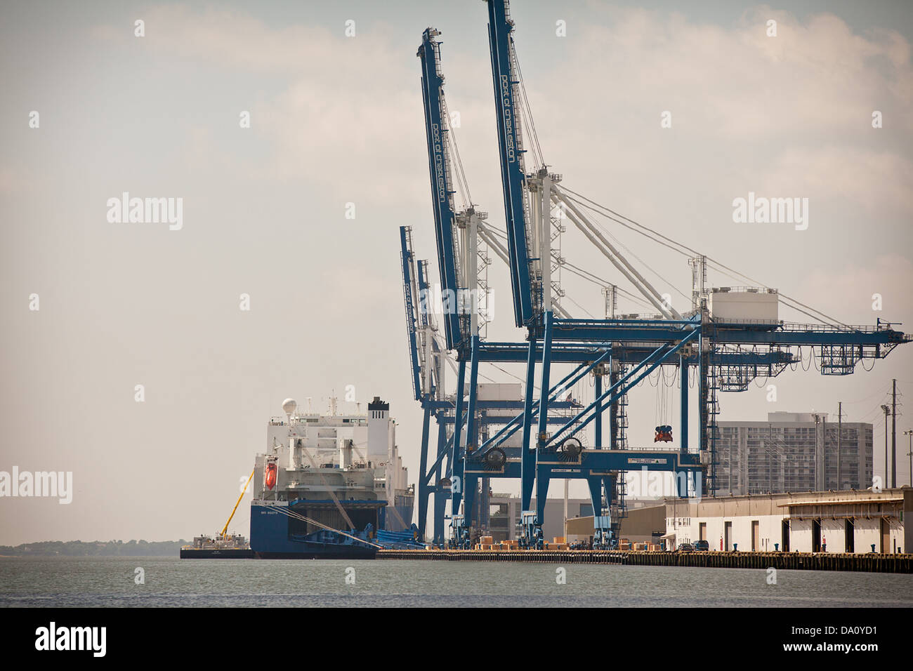 Cargo ship loads in the Port of Charleston in Charleston, SC Stock