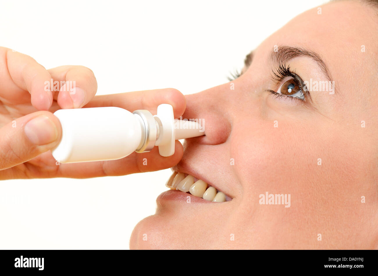 Woman using nasal spray Stock Photo