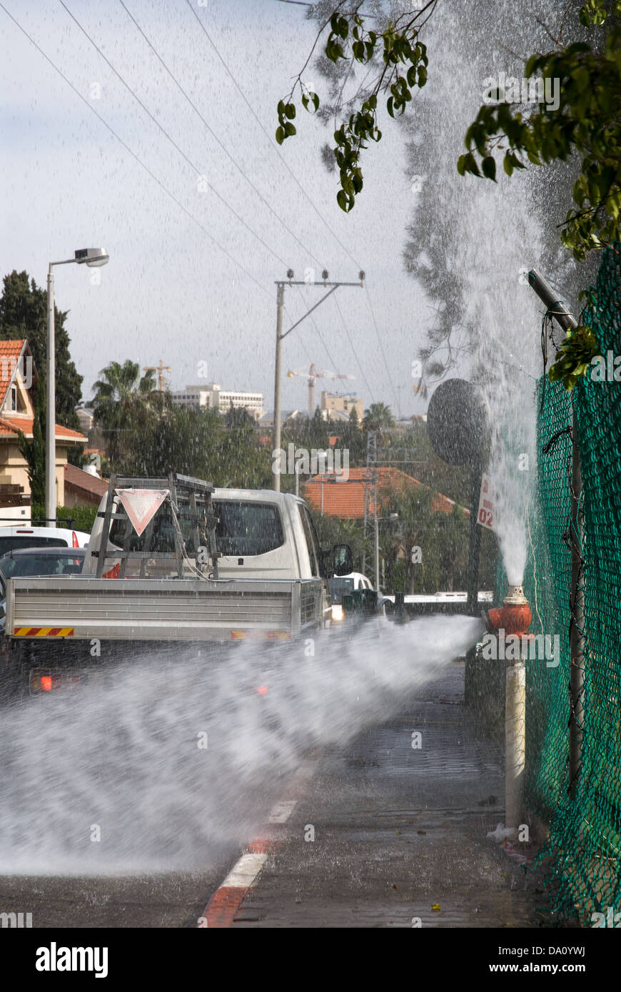 Faulty fire hydrant on the street in a city of Israel Stock Photo