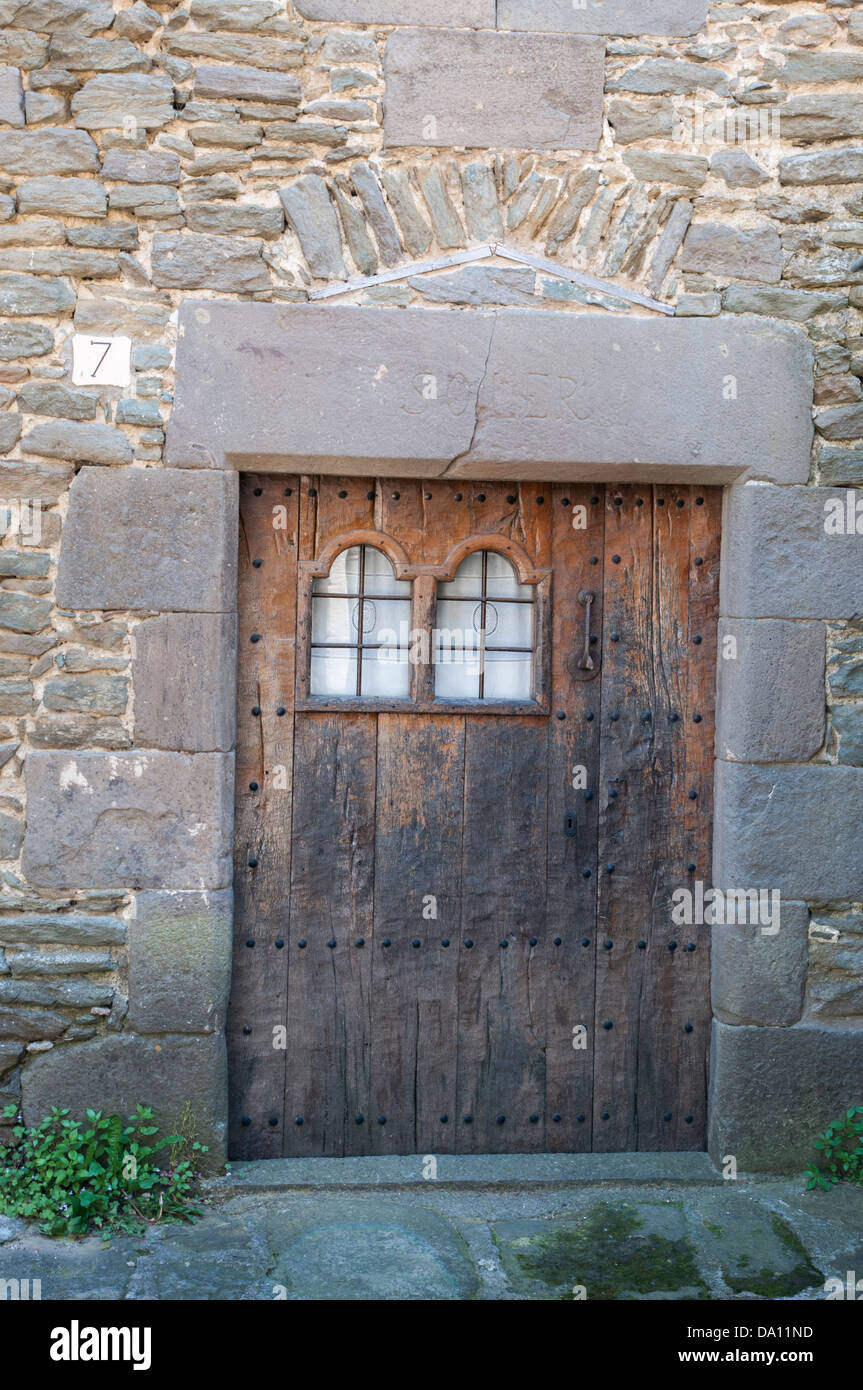 old wooden door with stone wall Stock Photo - Alamy