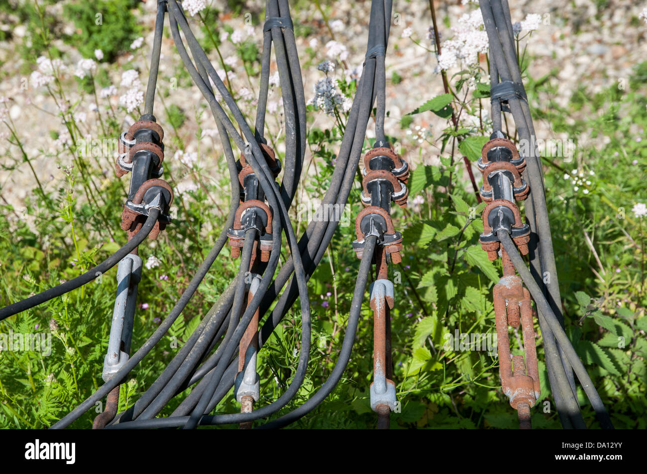 steel electric cables hanging Stock Photo