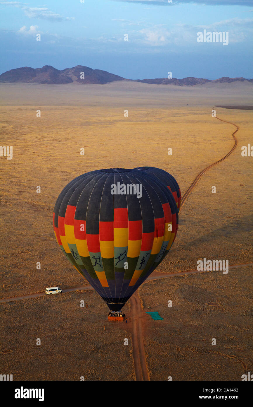 Launching hot air balloons, Namib Desert, near Sesriem, Namibia, Africa - aerial Stock Photo