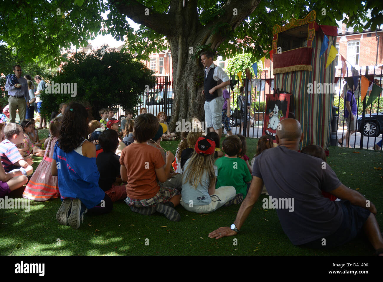 Primary school children watch a traditional Punch and Judy show at their annual school fair Stock Photo