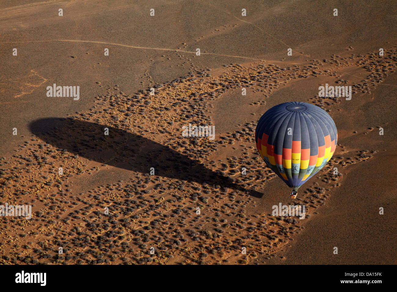 Hot air balloon over Namib Desert, near Sesriem, Namibia, Africa - aerial Stock Photo