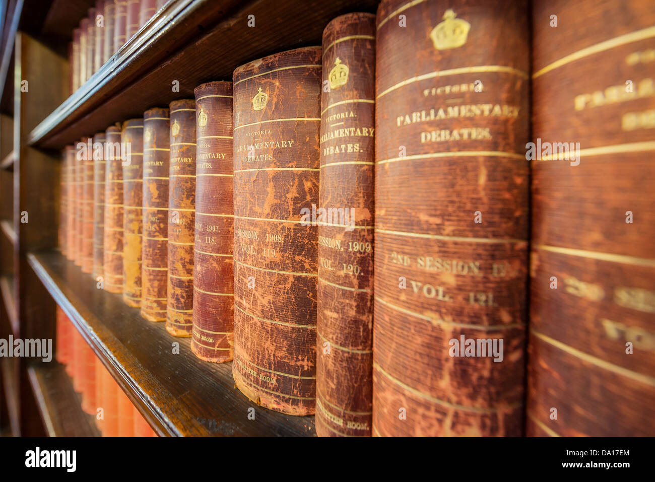 Some heavy reading among books on the shelves of the Parliament of Victoria in Australia. Stock Photo