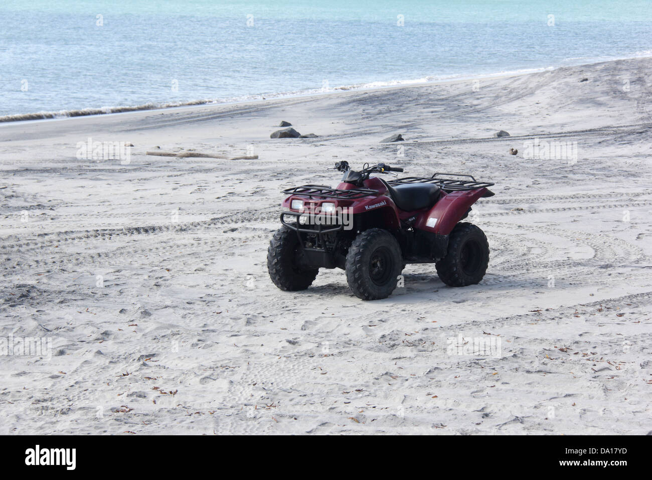 Four wheel bike at a beach. Stock Photo