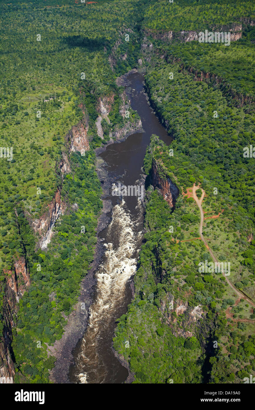White water rapids on Zambezi River in Batoka Gorge below Victoria Falls, Zimbabwe / Zambia Border, Southern Africa - aerial Stock Photo