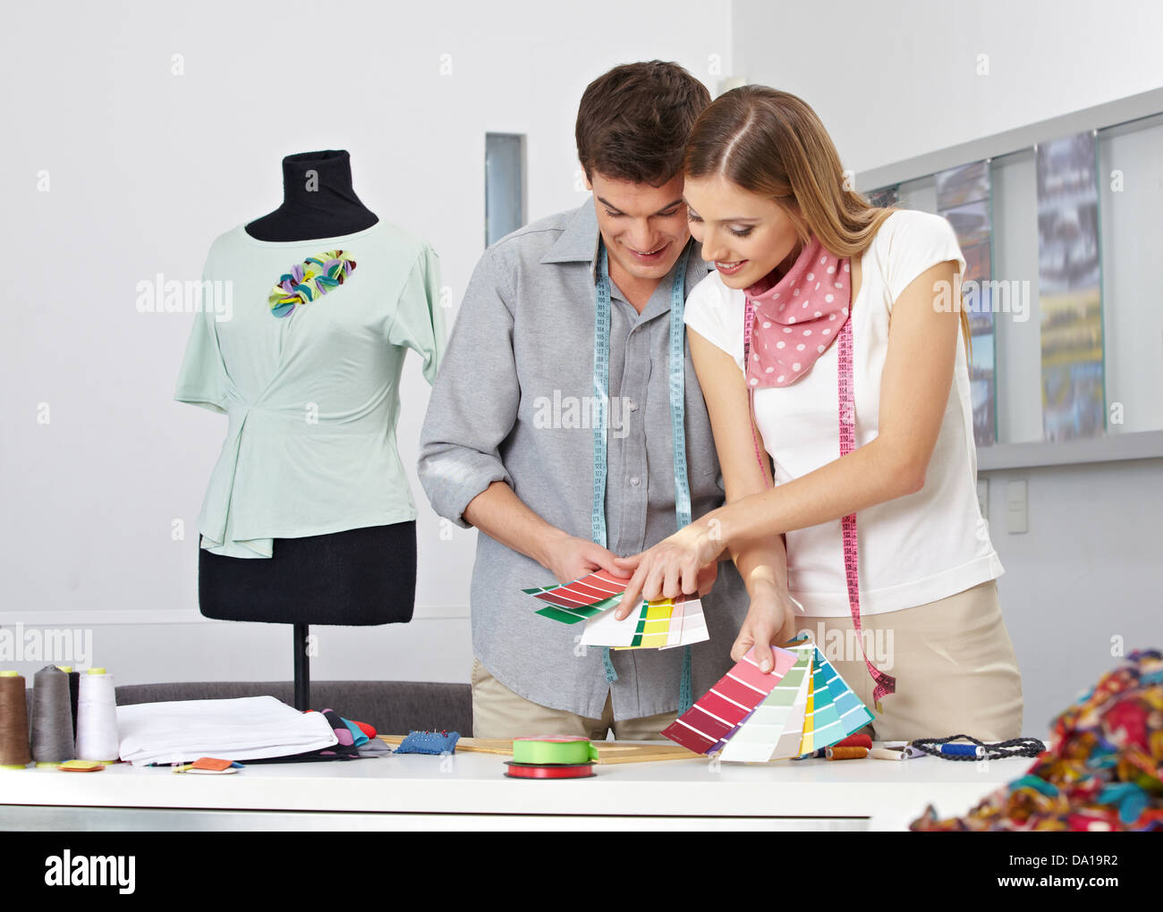 Two fashion designer making color choice with color samples in their studio Stock Photo