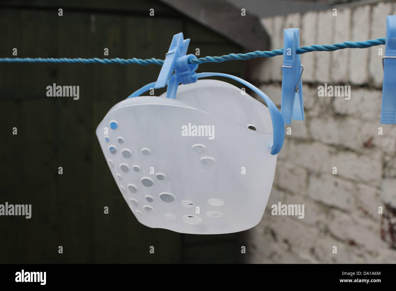 Washing line with pegs and peg holder, shed in background Stock Photo 57807644 Alamy