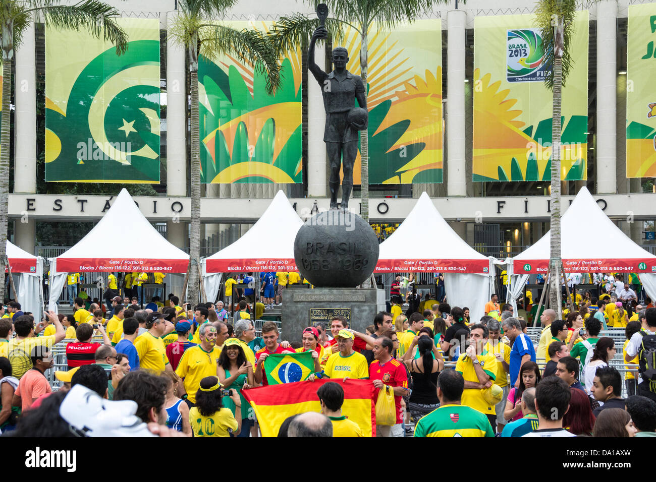Brazilian fans in front of the statue Bellini, in Game at Maracanã (Brazil and Spain) in the final of the FIFA Confederations Cup 2013 Stock Photo