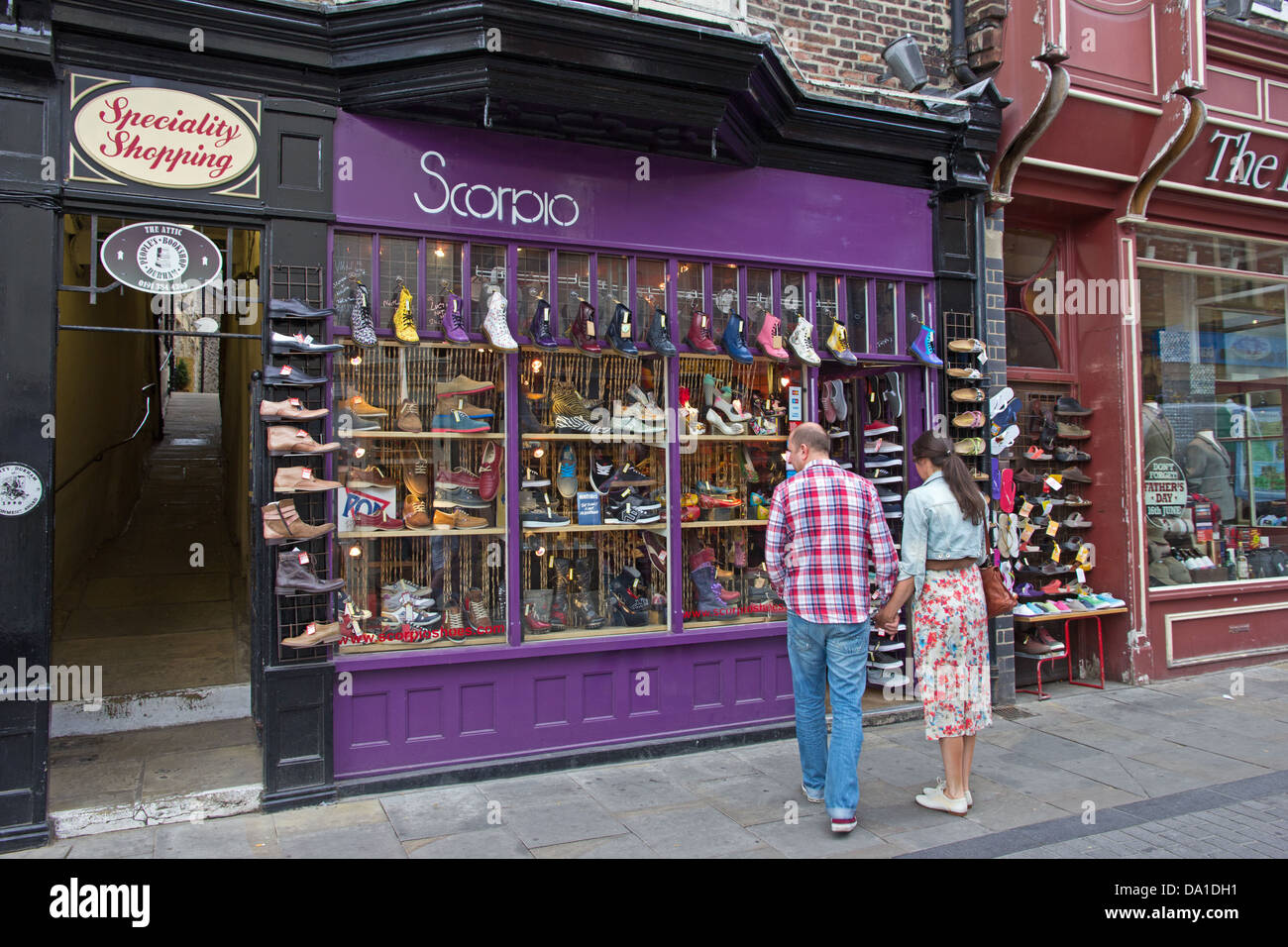 Couple looking in window of Scarpio shoe shop, Durham Stock Photo Alamy