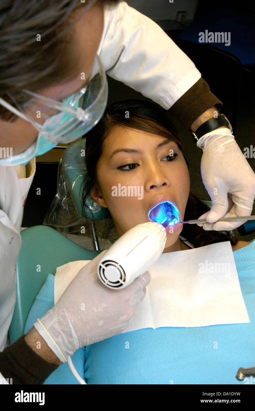 WOMAN RECEIVING DENTAL CARE Stock Photo Alamy