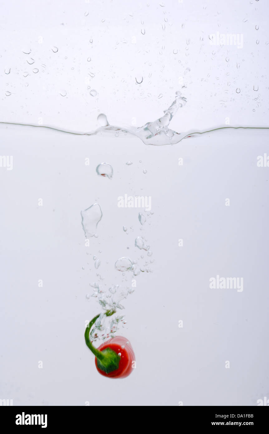 Chili pepper splashed into water Stock Photo Alamy