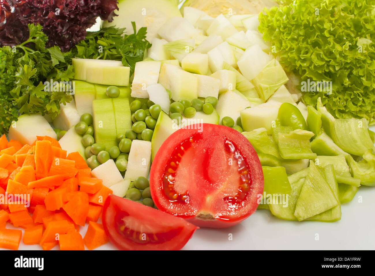 chopped vegetables for soup and salad leaves closeup Stock Photo