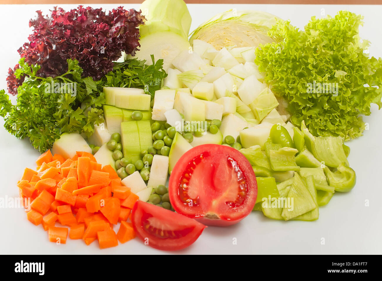 chopped vegetables for soup and salad leaves closeup Stock Photo