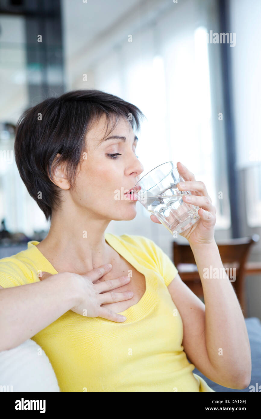 WOMAN WITH HOT FLUSH Stock Photo