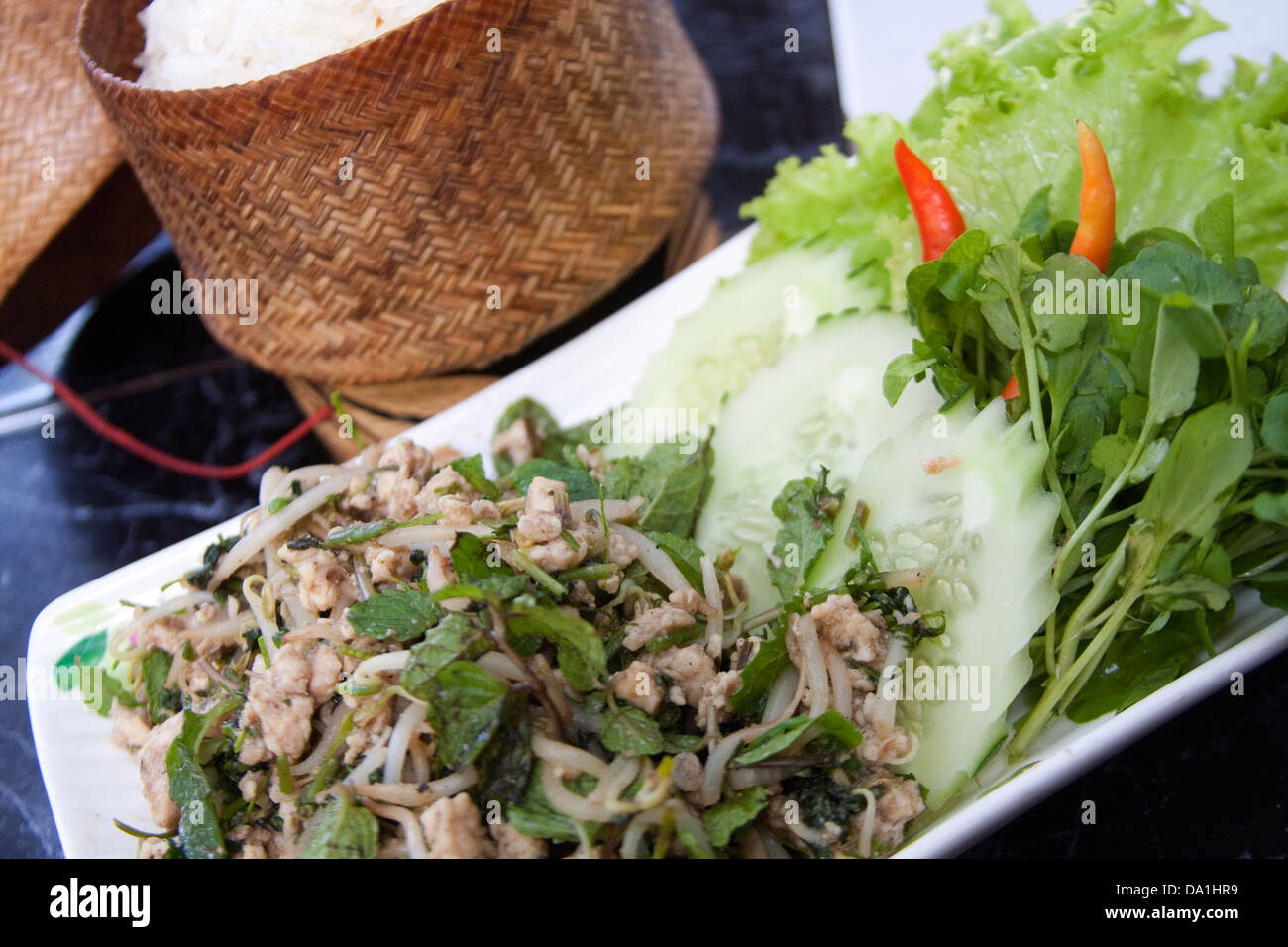Minced chicken 'laap' flavoured with local herbs (chilli, mint, Asian basil) and fish sauce.  Lao traditional dish Stock Photo