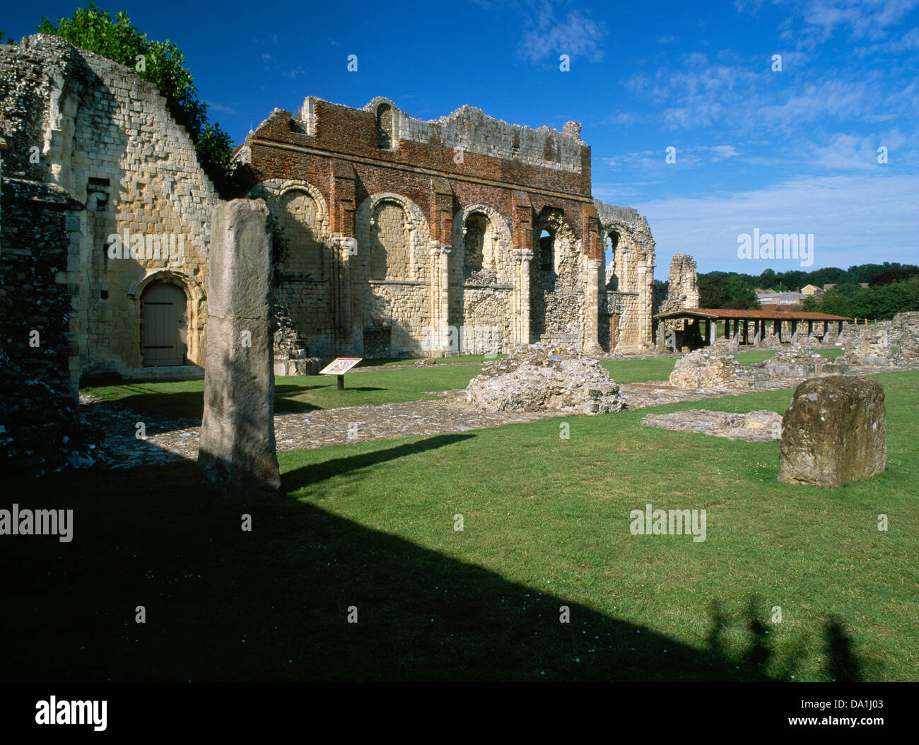 St Augustine's Abbey, Canterbury, Kent: N wall of Norman nave topped with brickwork of Tudor royal palace. Ethelbert Tower (rear L) Stock Photo