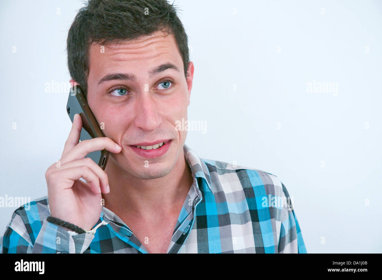 Young man using mobile phone. Close view. Stock Photo