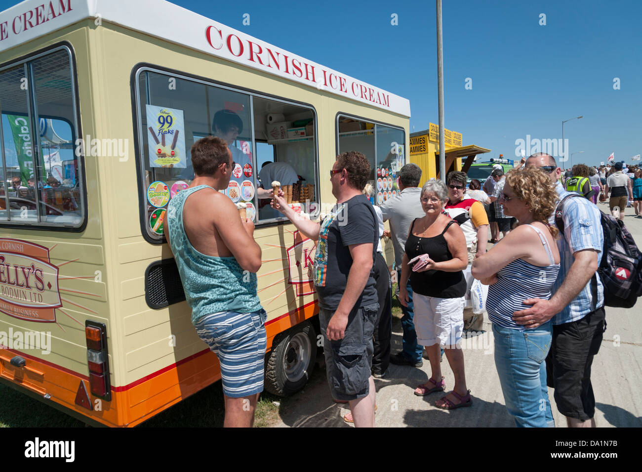 Customers buying ice creams from the Kellys Cornish Ice cream van at
