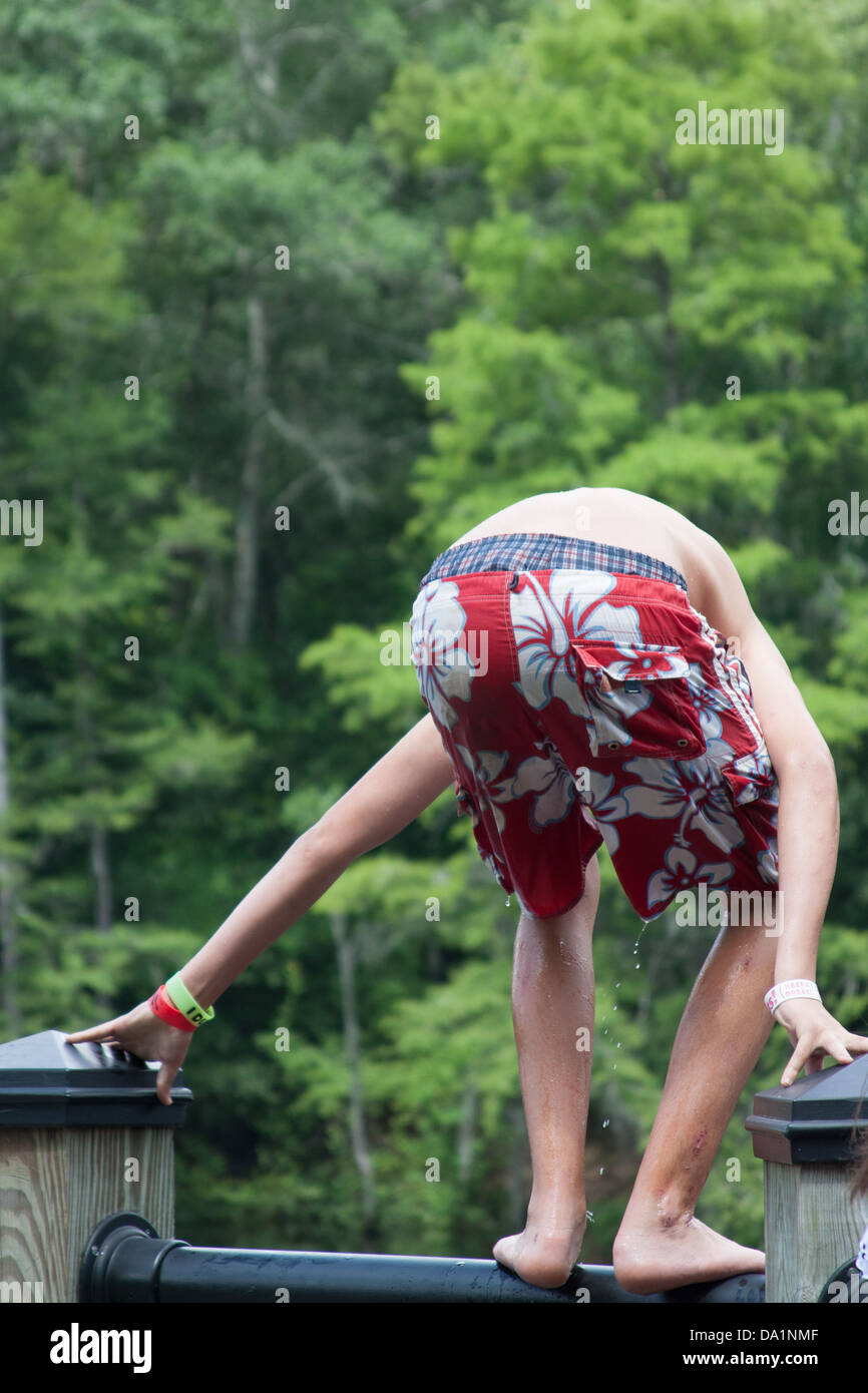 Teens Jumping Off The Railing Stock Photo Alamy