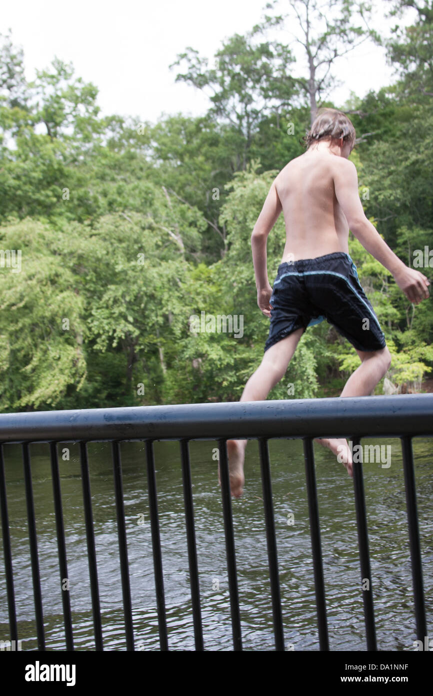 Teens Jumping Off The Railing Stock Photo Alamy