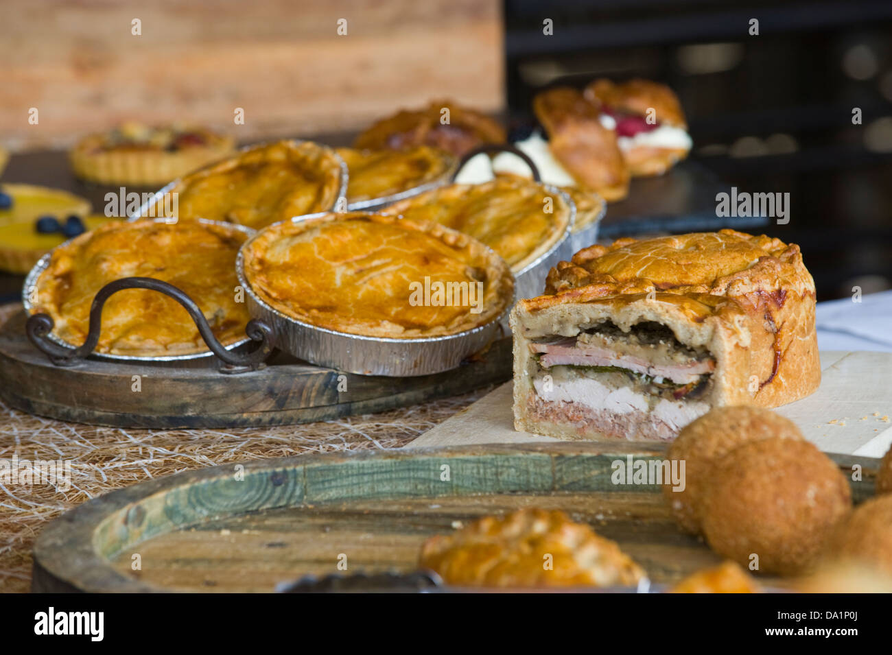 Pies on sale on stall at monthly farmers market in Malton Ryedale North ...