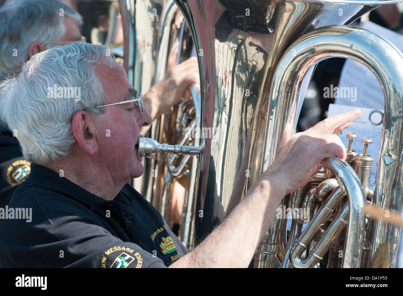 Man playing the tuba in the Pendennis brass band at Padstow harbour Cornwall UK Stock Photo