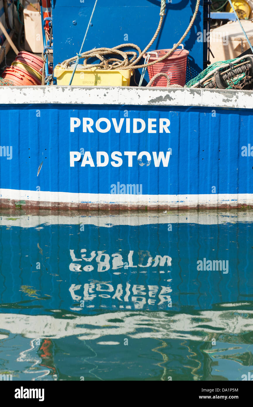 Close up of the stern of the trawler Provider at Padstow harbour Cornwall UK with reflections in the water Stock Photo
