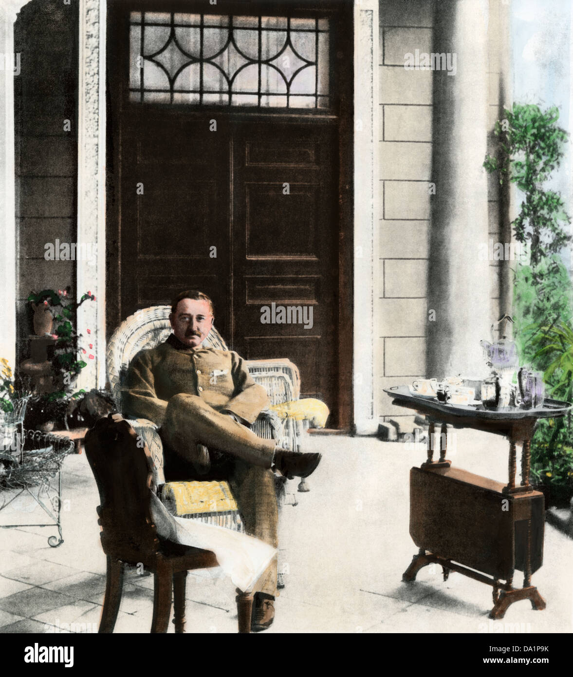 Cecil John Rhodes, British colonial administrator, on his verandah near Cape Town, South Africa, c. 1900. Hand-colored halftone of a photograph Stock Photo