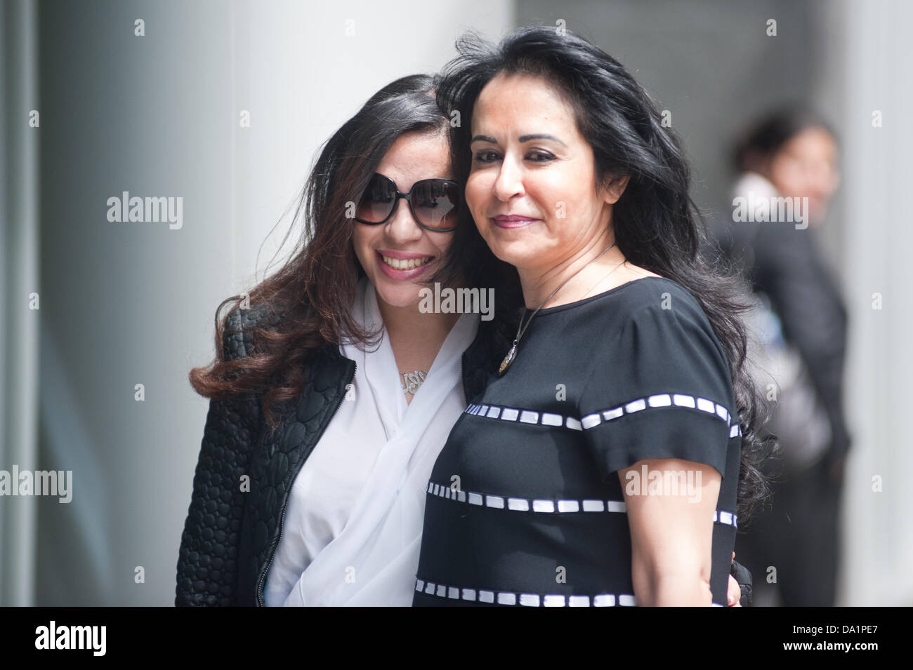 London, UK - 1 July 2013: Consultant Daad Sharab poses for a picture with her daughter outside the High Court. She claims  Saudi Prince Al-Waleed Bin Talal Bin Abdul-Aziz Al-Saud owes her around £6.5 million commission for the part she played in a 2005 Airbus deal. Prince Al-Waleed disputes her claim and denies that any agreement was made for a 'specific commission'. Credit:  Piero Cruciatti/Alamy Live News Stock Photo