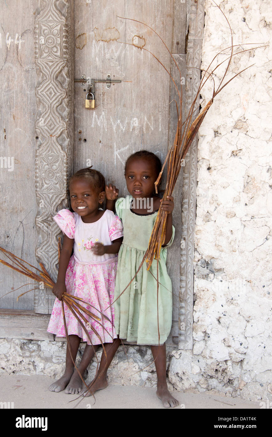 Two little girls play in Jambiani village, Zanzibar, United Republic of Tanzania, East Africa. Stock Photo
