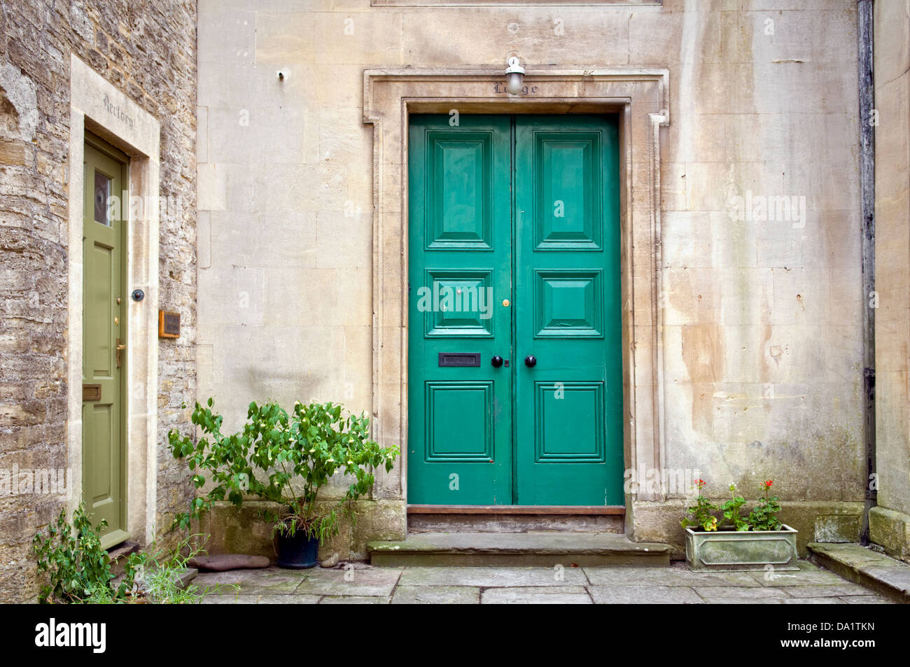 Pretty old fashioned green door in Frome, Somerset, UK Stock Photo