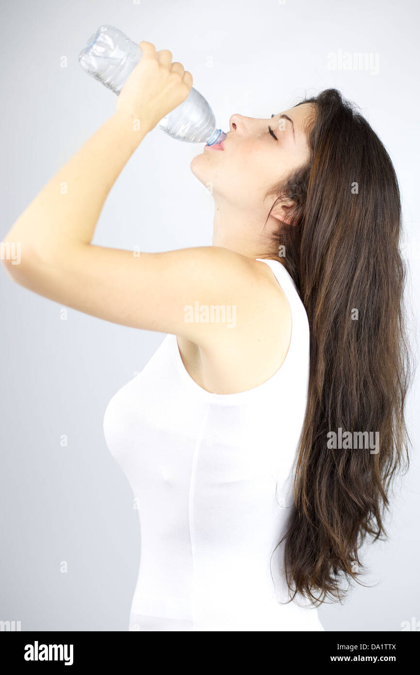 Beautiful woman with long healthy hair nice body drinking water Stock Photo - Alamy Beautiful woman with long healthy hair nice body drinking water Stock Photo - Alamy