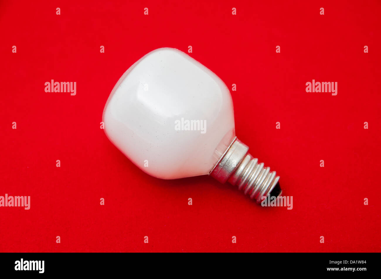 White light bulb on a red background Stock Photo Alamy