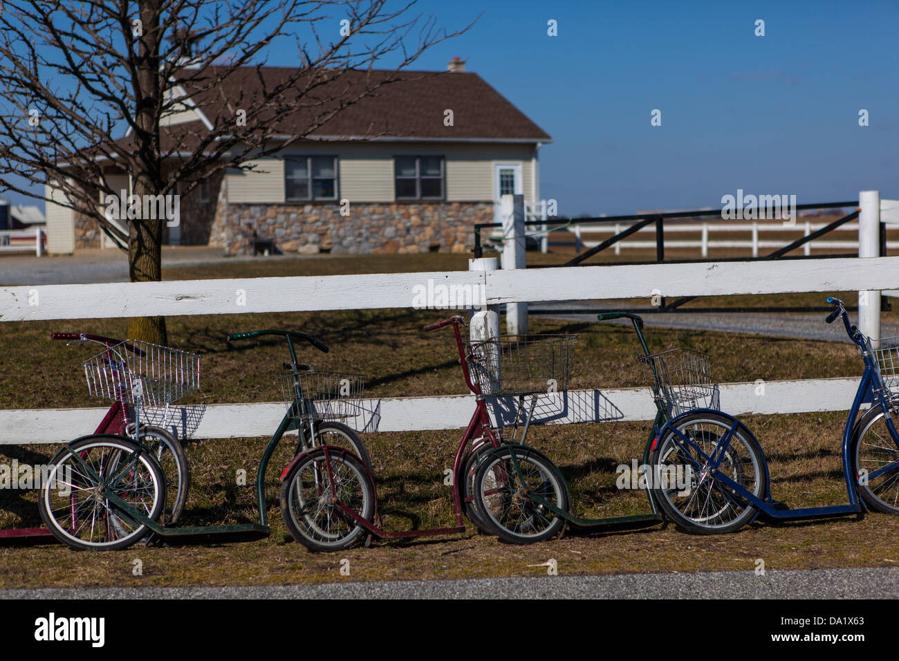 Amish students park their scooter bikes outside their one room school house in Lancaster county, PA. Stock Photo