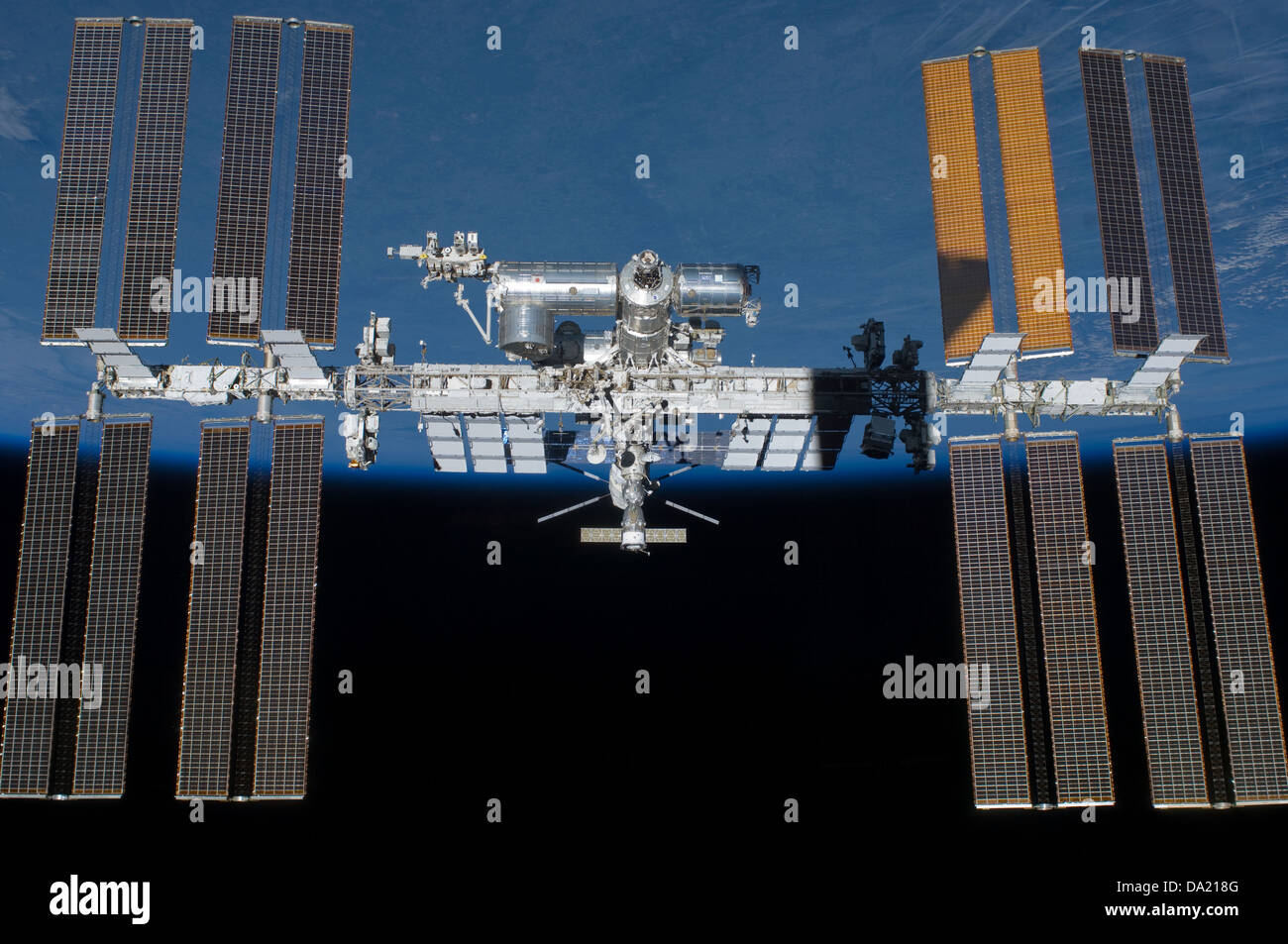 computer enhanced NASA image of International Space Station (ISS) flying above earth Stock Photo