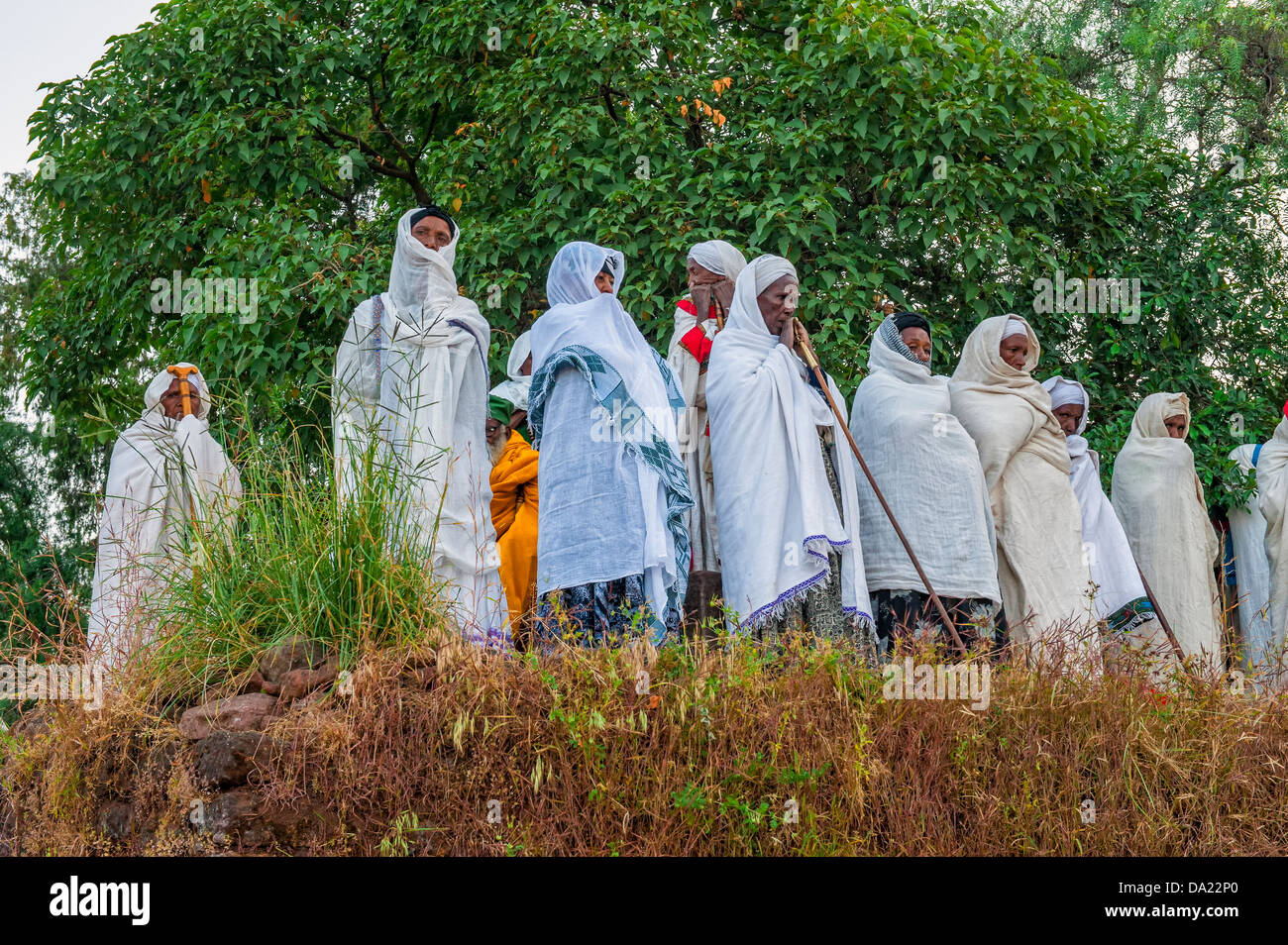 Pilgrims with the traditional white shawl attending a ceremony at the Bete Medhane Alem Church, Lalibela, Ethiopia Stock Photo