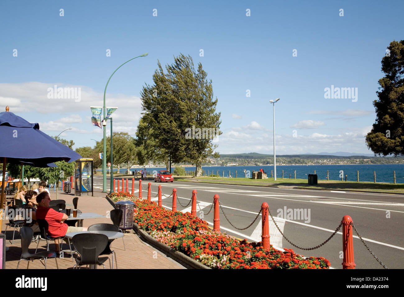 The neatly manicured and visitor friendly town of Taupo nestles on the shores of volcanically formed Lake Taupo, New Zealand. Stock Photo
