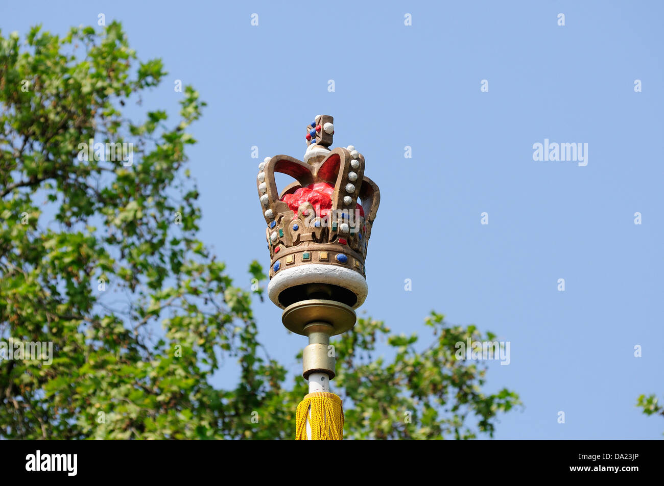 Crown on flag pole in the mall Stock Photo