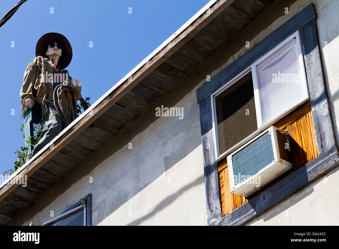 Street view of artistically dressed mannequin on roof of the Surfing Museum in the Funk Zone in Santa Barbara, California Stock Photo