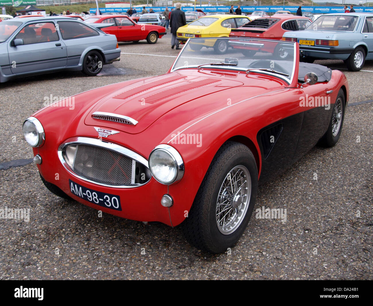 The 1962 Austin Healey 3000 MK2, featured at the 2010 Nationaal Oldtimer Festival in Zandvoort, is a classic British sports car known for its powerful engine and sleek design. This model is celebrated for its performance in motorsports and remains a sought-after collector’s item. Stock Photo