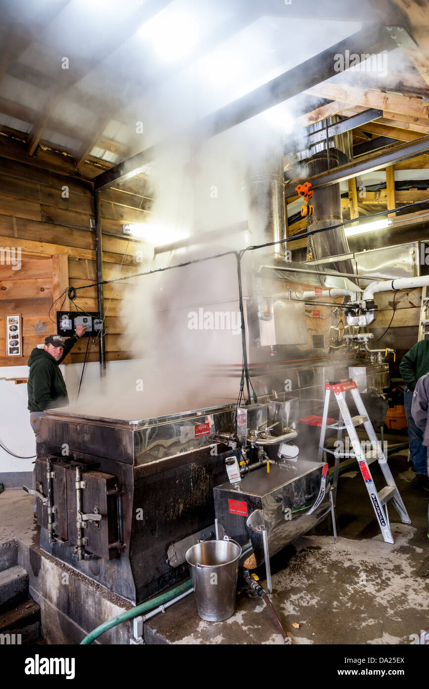 Traditional late-winter boiling of sap in an evaporator, to make maple syrup, Adirondacks, New York State Stock Photo