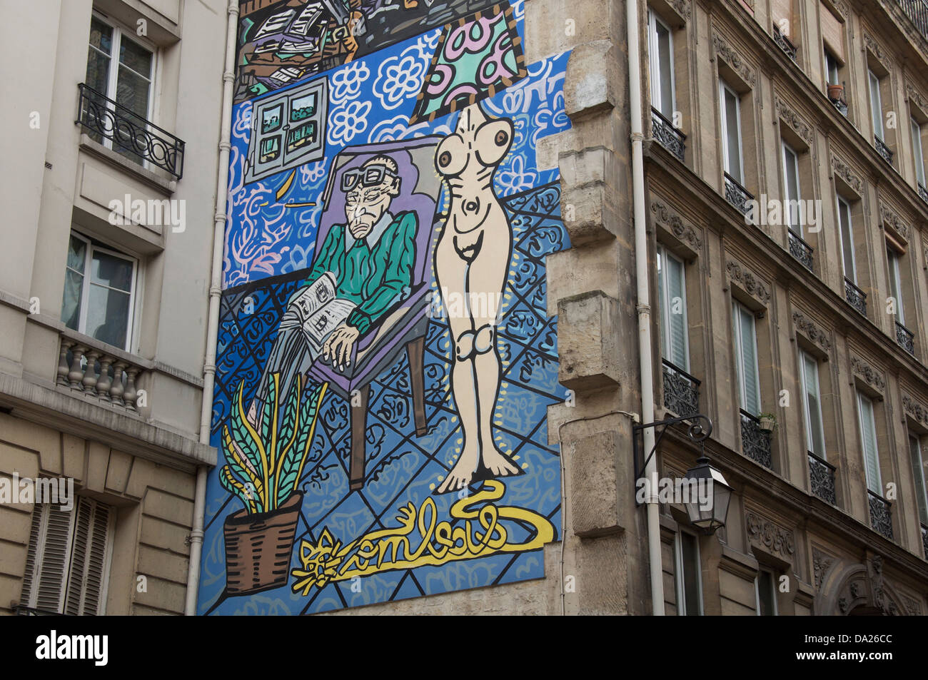 Parisian street art. La femme, la lumière de l’homme, Woman is the light of the man. A Mural by Robert Combas, in the Marais district of Paris. France. Stock Photo