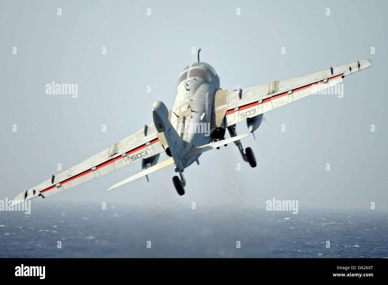 A US Navy EA-6B Prowler Electronic Attack aircraft launches from the aircraft carrier USS Dwight D. Eisenhower June 30, 2013 returning to homeport in Norfolk, VA. Stock Photo
