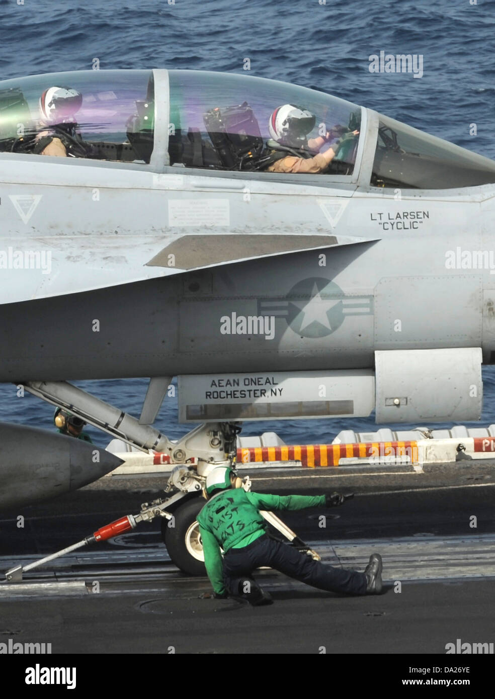 A US Navy F/A-18F Super Hornet fighter aircraft prepares to launch from the aircraft carrier USS Nimitz June 29, 2013 operating in the Arabian Sea. The Nimitz Carrier Strike Group is deployed to the U.S. 5th Fleet area of responsibility conducting maritime security operations, theater security cooperation efforts and support missions for Operation Enduring Freedom. Stock Photo